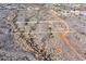 Overhead view of 3 desert lots marked with identification numbers, with native shrubs, city, and mountain views at Xxx N 158Th Ave, Surprise, AZ 85387