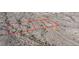 Aerial view of land parcel in desert landscape, showcasing a potential building site with surrounding vegetation at Xxx N 158Th Ave, Surprise, AZ 85387