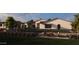 Relaxing backyard with a pool, lounge chairs, barbecue area, and beautiful desert landscaping at Xxx N 158Th Ave, Surprise, AZ 85387