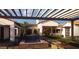 Beautiful backyard featuring a pool with spa, covered patio, and comfortable seating area at Xxx N 158Th Ave, Surprise, AZ 85387