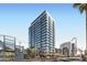 Modern high-rise building featuring floor-to-ceiling windows and contemporary architecture against a blue sky at 1 E Lexington Ave # 503, Phoenix, AZ 85012