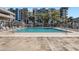 A community outdoor swimming pool with lounge chairs and seating areas at 1 E Lexington Ave # 503, Phoenix, AZ 85012