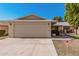 Charming home featuring a two-car garage, well-kept lawn, and inviting curb appeal at 10439 W Saratoga Cir, Sun City, AZ 85351