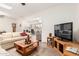 Bright, spacious living room with hardwood floors and ample seating at 10439 W Saratoga Cir, Sun City, AZ 85351