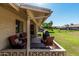 Cozy outdoor patio with comfortable seating and a barbecue, perfect for relaxation at 10439 W Saratoga Cir, Sun City, AZ 85351