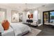 Serene main bedroom with dark wood floors, artwork, and a seating area near windows and a doorway at 10585 E Crescent Moon Dr # 44, Scottsdale, AZ 85262