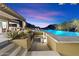 Inviting pool area featuring a built-in waterfall feature and lounge chairs, offering a serene outdoor experience at 10585 E Crescent Moon Dr # 44, Scottsdale, AZ 85262