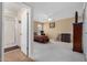 Bedroom features a bathroom with a shower and neutral colored walls and carpet at 10718 W Welk Dr, Sun City, AZ 85373