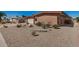 Single story home featuring low maintenance desert landscaping with brick accents and mature plants at 10718 W Welk Dr, Sun City, AZ 85373