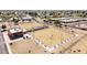 Aerial view of lawn bowling with covered seating and a golf cart to help players get from end to end at 10718 W Welk Dr, Sun City, AZ 85373