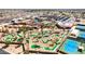 Extensive aerial view of a beautiful putt-putt course surrounded by parking and many other amenities at 10718 W Welk Dr, Sun City, AZ 85373