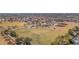 Community aerial view showcasing a green sports field, multiple playgrounds, picnic tables, and mature trees at 1166 E Del Rio St, Chandler, AZ 85225