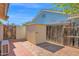 This backyard features a brick patio and a storage shed at 1166 E Del Rio St, Chandler, AZ 85225