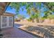 This backyard features a brick patio and wood fence at 1166 E Del Rio St, Chandler, AZ 85225