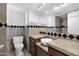 Well-lit bathroom with granite countertops, modern sink, and toilet at 1166 E Del Rio St, Chandler, AZ 85225