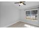 This bedroom features a ceiling fan and natural light from the window at 1166 E Del Rio St, Chandler, AZ 85225