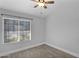 Bright bedroom with wood floors, ceiling fan, and window at 1166 E Del Rio St, Chandler, AZ 85225