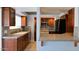 View into kitchen with granite countertops, dark cabinetry, and stainless steel appliances at 1166 E Del Rio St, Chandler, AZ 85225