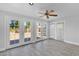 Airy living room with tile floors, ceiling fan, and large windows to the backyard at 1166 E Del Rio St, Chandler, AZ 85225