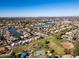 An aerial view of the neighborhood with a lake, community park, and playground at 1233 E Azure Sea Ln, Gilbert, AZ 85234