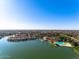 Overhead view showing the homes, with a lake and artificial beach to enhance appeal at 1233 E Azure Sea Ln, Gilbert, AZ 85234