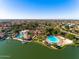 Breathtaking aerial view of the community highlighting lush landscaping and the artificial beach at 1233 E Azure Sea Ln, Gilbert, AZ 85234