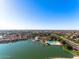 Expansive aerial view showing the Personal-made lake and beach with the community in the background at 1233 E Azure Sea Ln, Gilbert, AZ 85234