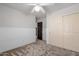 Bedroom featuring neutral wainscoting, plush carpeting and sliding closet doors at 1233 E Azure Sea Ln, Gilbert, AZ 85234