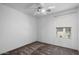 Neutral bedroom with a ceiling fan and a sunlit window at 1233 E Azure Sea Ln, Gilbert, AZ 85234