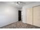 Simple bedroom with sliding closet doors and neutral carpeting at 1233 E Azure Sea Ln, Gilbert, AZ 85234