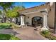 Elegant clubhouse entrance featuring stone columns, decorative benches and lush landscaping at 1233 E Azure Sea Ln, Gilbert, AZ 85234