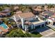 Charming two-story home with a three car garage, beautiful tile roof, and manicured front yard at 1233 E Azure Sea Ln, Gilbert, AZ 85234