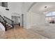 Grand foyer with tile entry, staircase, and open layout connecting to a bright living space at 1233 E Azure Sea Ln, Gilbert, AZ 85234