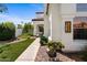 A manicured front yard leads to a charming home with a decorative address plaque, enhancing its curb appeal at 1233 E Azure Sea Ln, Gilbert, AZ 85234