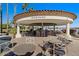 Palm Patio offers a relaxing outdoor seating area with tables and chairs near the water at 1233 E Azure Sea Ln, Gilbert, AZ 85234