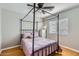 This bedroom features a four poster bed and light colored walls at 13444 W Ocotillo Ln, Surprise, AZ 85374