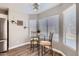 Cozy dining area with natural light from windows, complemented by a stylish light fixture at 13444 W Ocotillo Ln, Surprise, AZ 85374