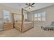 Bedroom featuring natural wood four poster bed frame and a neutral color scheme with bright natural light at 1356 E Penedes Ct, Gilbert, AZ 85298