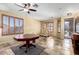 Open-concept room featuring tile floors, a ceiling fan, and a custom play area at 1412 E Jade Dr, Chandler, AZ 85286