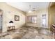 Neutral living room with tile floors, ceiling fan, and outdoor access at 1412 E Jade Dr, Chandler, AZ 85286