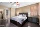 Bedroom with hardwood floors, ensuite bathroom, and natural lighting at 1412 E Jade Dr, Chandler, AZ 85286