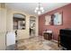 Inviting office with tile flooring, decorative chandelier, and a view into an adjacent room at 1412 E Jade Dr, Chandler, AZ 85286