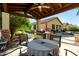 Charming outdoor kitchen and dining area with a built-in grill, perfect for summer barbecues and gatherings at 1412 E Jade Dr, Chandler, AZ 85286