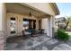 Covered patio with stone flooring, comfortable seating, and view of the outdoors at 1412 E Jade Dr, Chandler, AZ 85286