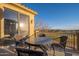 Balcony features a glass-topped patio table with seating and views of the golf course at 14257 W Harvard St, Goodyear, AZ 85395