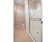 A tiled bathroom featuring a toilet and shower with glass doors, creating a clean and functional space at 14257 W Harvard St, Goodyear, AZ 85395