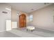 Bedroom featuring neutral carpet, an ornate armoire, and a window with natural light at 14257 W Harvard St, Goodyear, AZ 85395