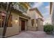 Welcoming front entrance featuring desert landscaping, brick pathway and a warm inviting entryway at 14257 W Harvard St, Goodyear, AZ 85395