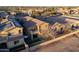 Aerial view of a charming home with a quaint balcony, cozy patio, and fenced yard, ideal for outdoor living and privacy at 14257 W Harvard St, Goodyear, AZ 85395