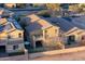 Aerial view of a residence featuring a patio and balcony, situated in a neatly landscaped backyard for relaxation and enjoyment at 14257 W Harvard St, Goodyear, AZ 85395